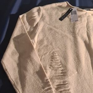 A beautiful cream colored sweater